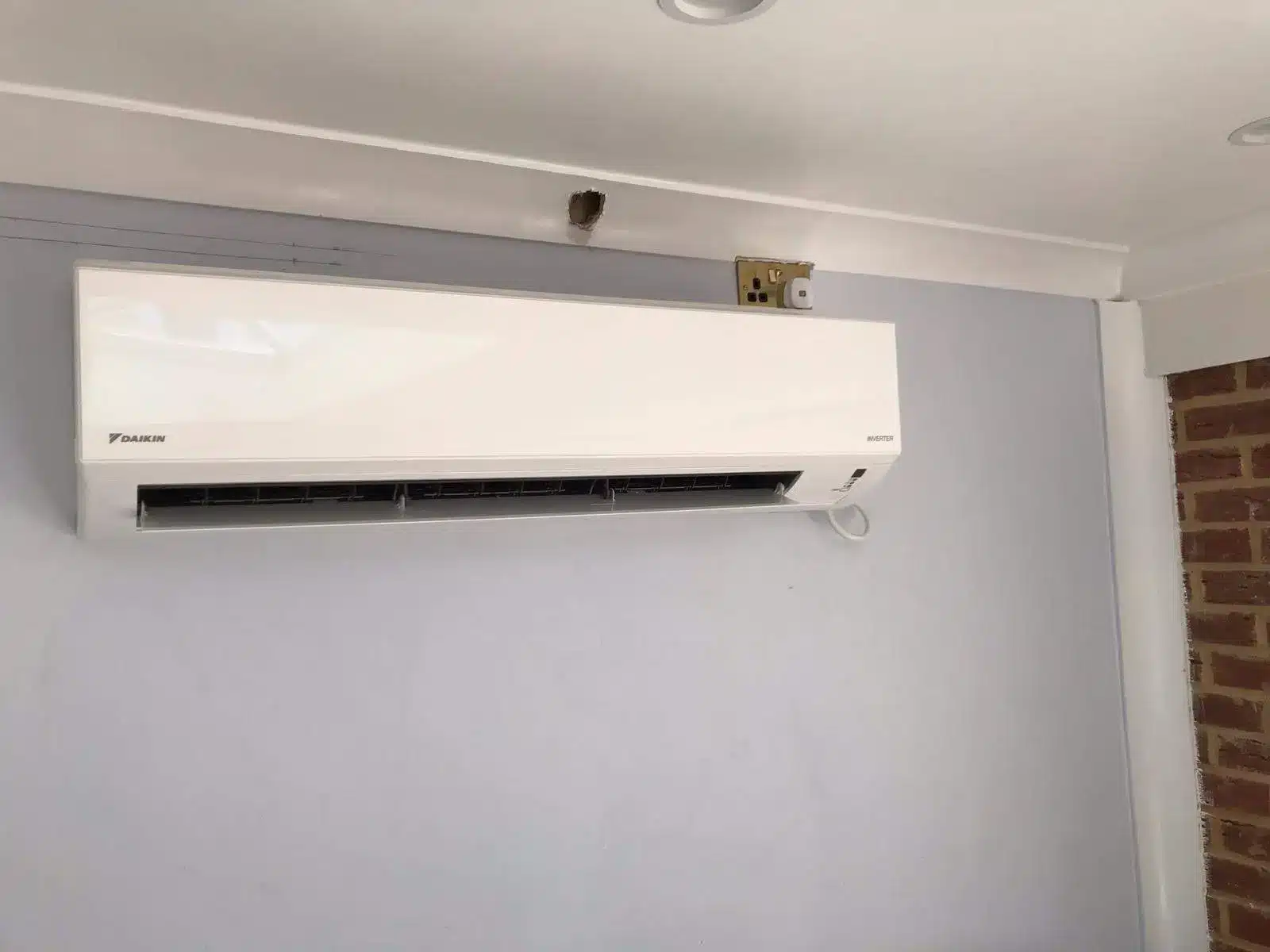 Daikin inverter air conditioner mounted installed in residential address in Ilford London