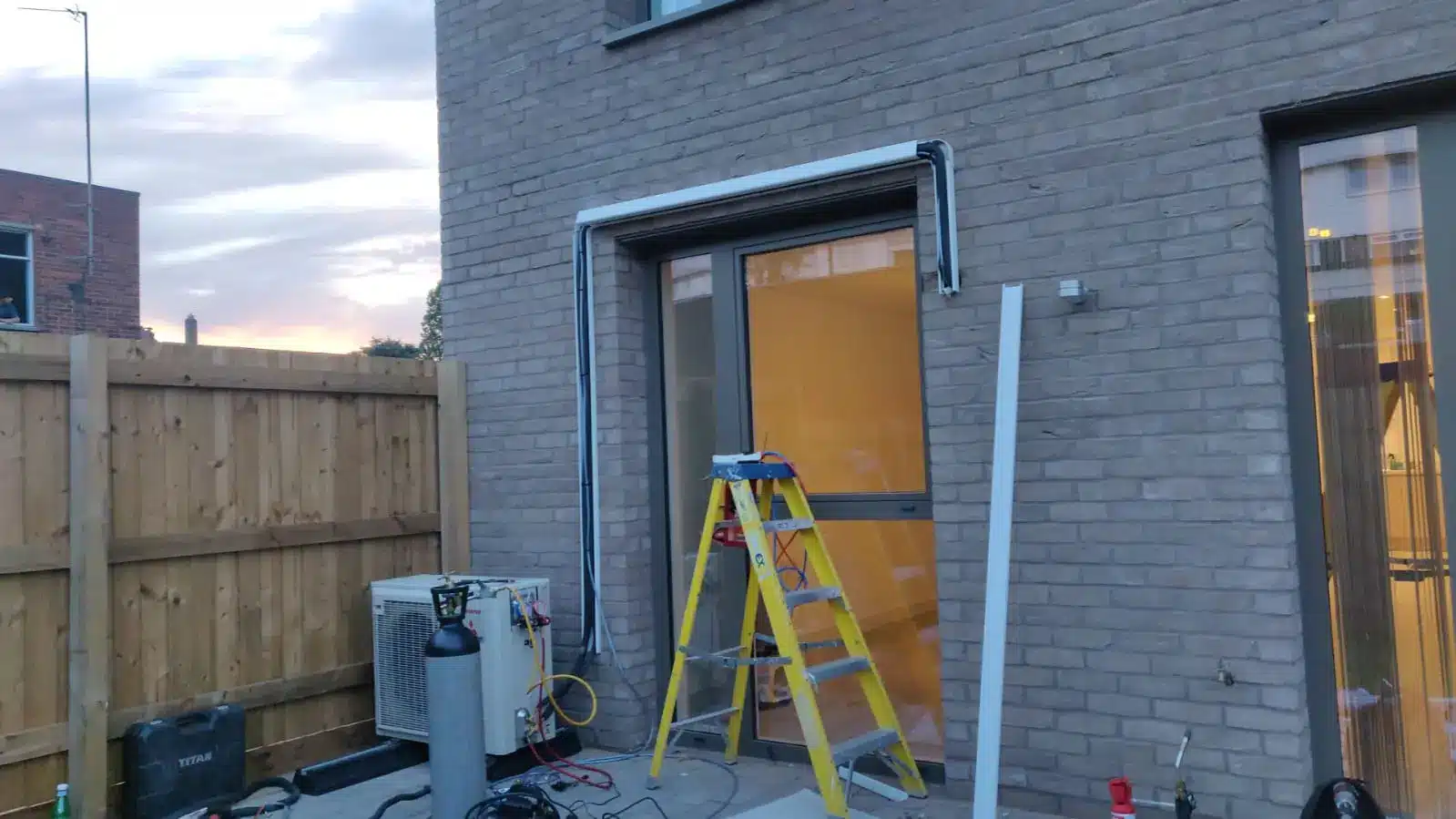 Installation of an outdoor air conditioning unit in Lewisham London