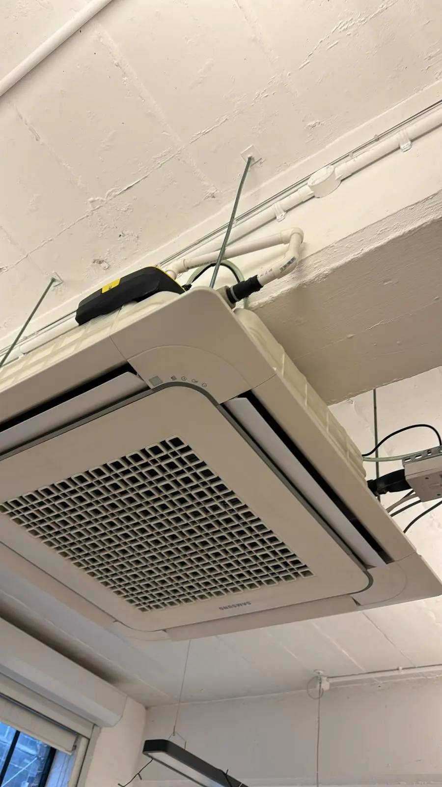 samsung cassette type air conditioning installation in a hardware store in pinner London